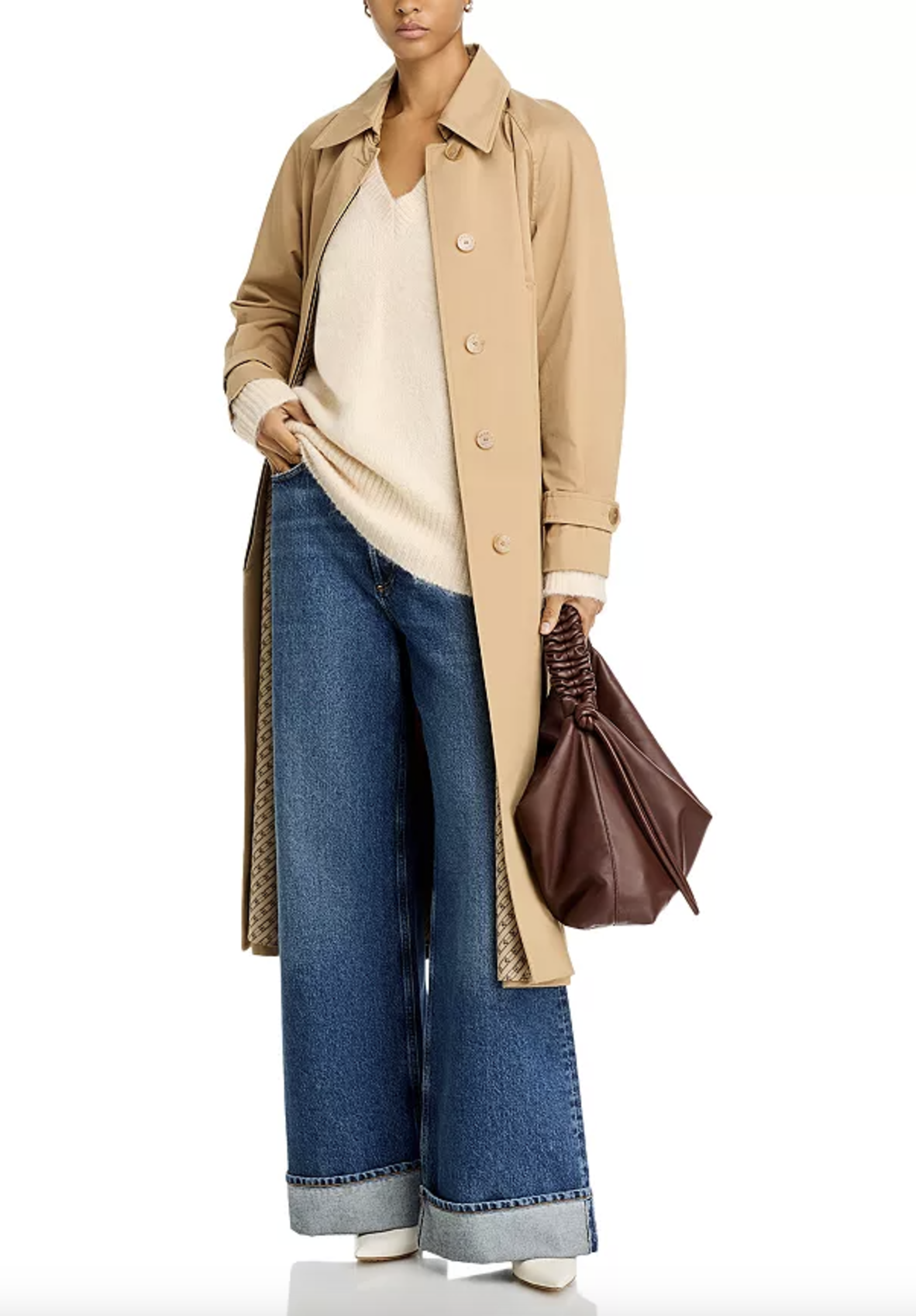 woman wearing sweater, jeans and trench coat